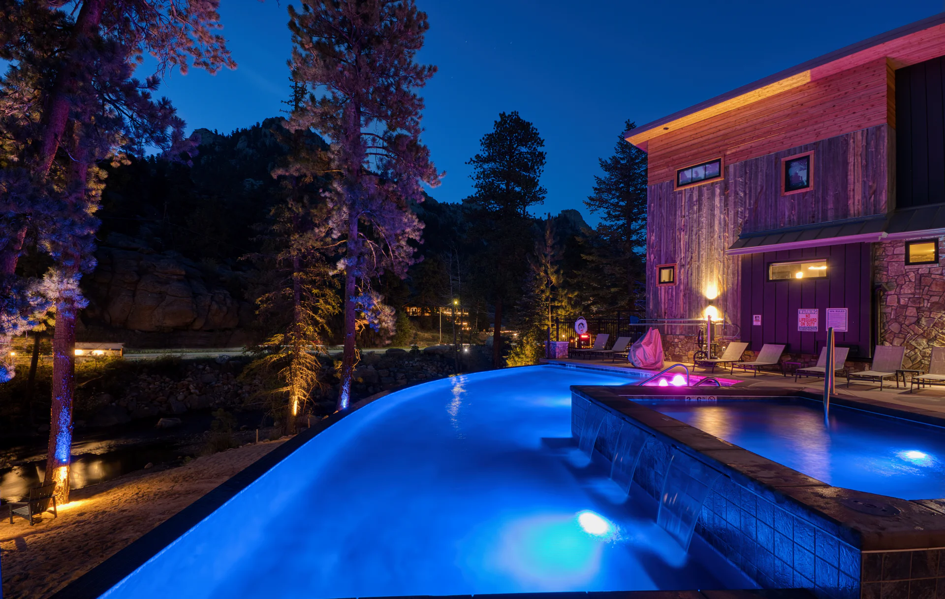 Infinity pool at dusk beside Fall River